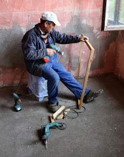 Bekir constructing a frame