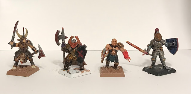 Some of the first miniatures my son has painted.  He likes to make liberal use of Blood For The Blood God.