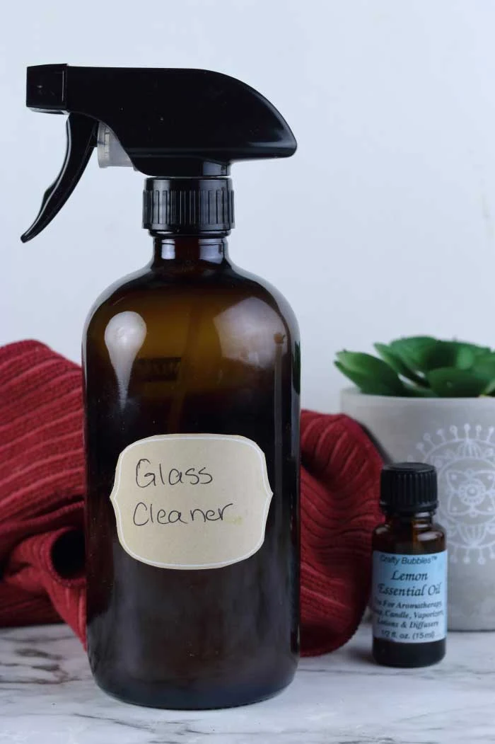 This diy window and mirror cleaner is an easy diy cleaning products recipe to make.  Cleaning with essential oils helps you get your home clean naturally.  This diy window cleaner natural has lemon essential oil to cut create.  DIY window cleaner essential oils for a natural clean.  Window cleaner homemade streak free thanks to a secret ingredient.  Window cleaner homemade with vinegar and rubbing alcohol.  #window #glass #mirror #essentialoils #diy #recipe #cleaning #naturalcleaning #ecofriendly #natural