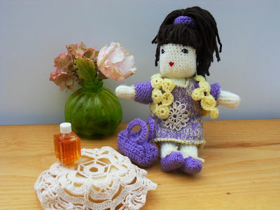 wool doll with purple poupée en laine en violet