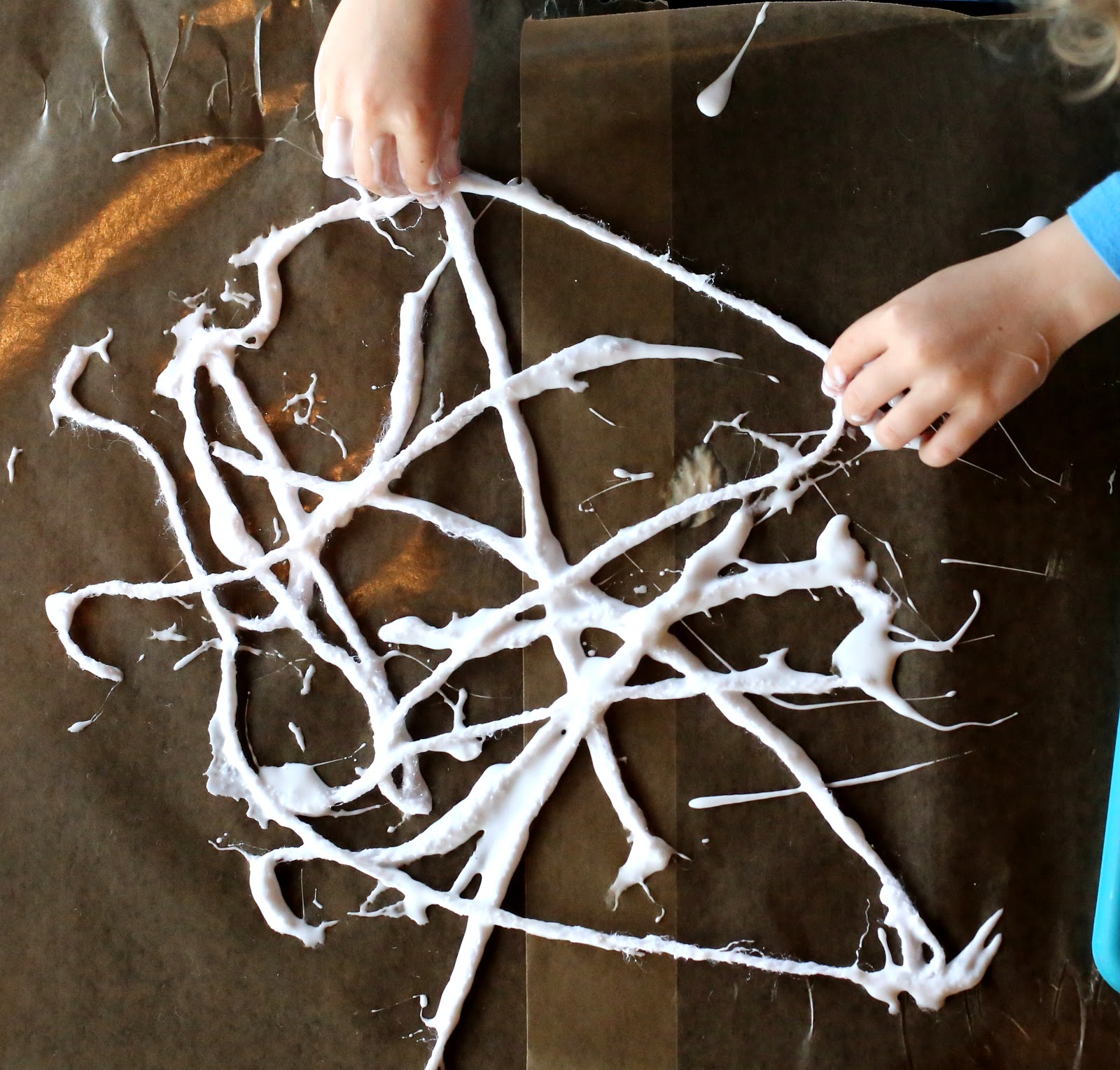 Kid-Made Halloween Decorations: Hanging Spiderwebs