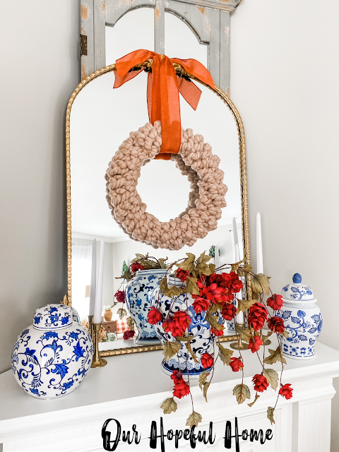 fall mantel decor gold mirror knit wreath ginger jars