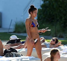 She's just publishing a new music single deal and Cassie Ventura lounged pretty pleased with herself wearing a colourful bikini in her day out at Miami poolside.