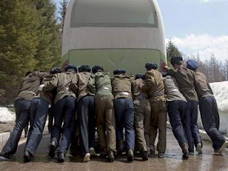 North Korean soldiers push the bus on strike