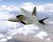 F22 Raptors fly in formation. The Air Force's first four pilots to go .