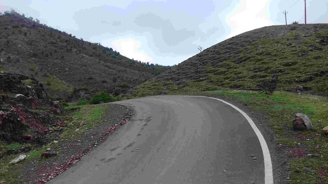 "A long, open highway stretching into the horizon, symbolizing the beginning of a journey as a yogi."