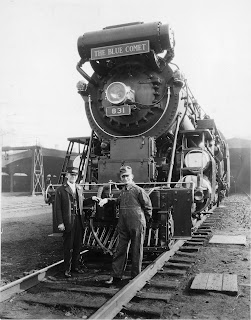 Conductor Joseph T. Ross (L) and engineer John Wait at Jersey City, circa 1930, with Central of New Jersey Blue Comet locomotive 831