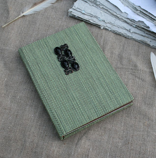 Hardcover notebook with a jewelery emblem