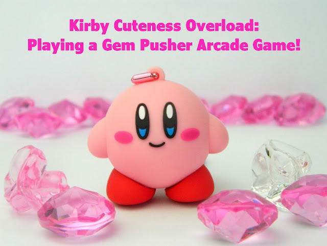 A photo of a Nintendo Kirby keychain and some shiny plastic gems 