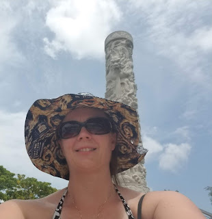 Chris in the hat, showing the exploding TARDIS inside. Background is a totem pole and sky.