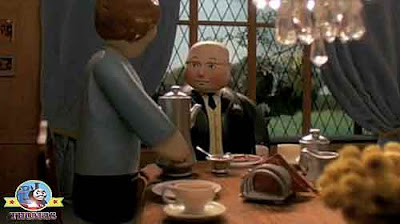 The Fat Controller having a Scottish traditional porridge breakfast eating hot toast and marmalade