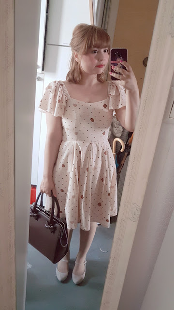 mirror selfie with auris wearing a cookie dress by lady sloth and a brown bag