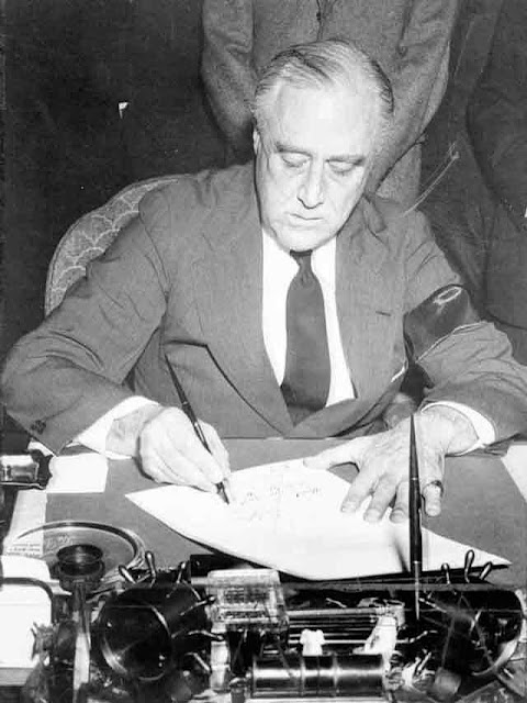 FDR signs the declaration of war, 11 December 1941 worldwartwo.filminspector.com