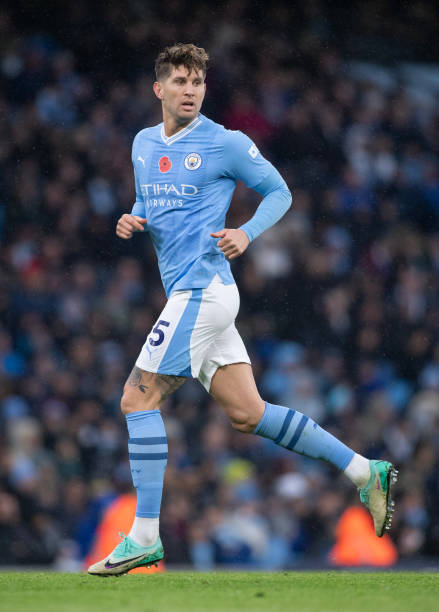 John Stones of Manchester City in action during the Premier League match between Manchester City and AFC Bournemouth at Etihad Stadium on November 4, 2023 in Manchester, England.