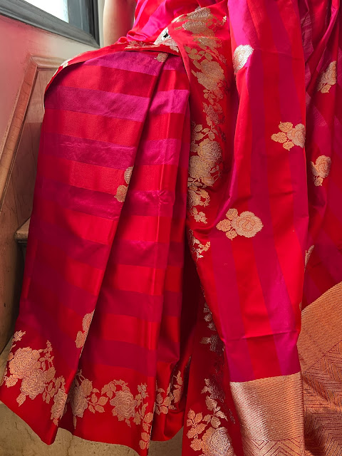 Radiant in Red and Pink: The Mushroo Silk Striped Saree with Kaduwa Weave and Enchanting Rose Motifs