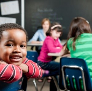 Smiling black-pupil at school