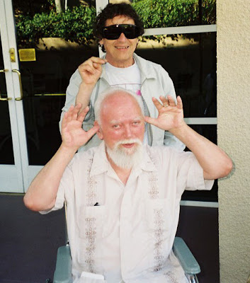 Bob (in wheelchair) clowning with Paul Krassner at the Prophets' Con 2000