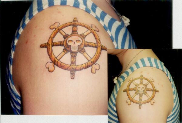 Tattoo; Color, Boat Wheels with Skull, Both Arms. Posted by Collin Kasyan