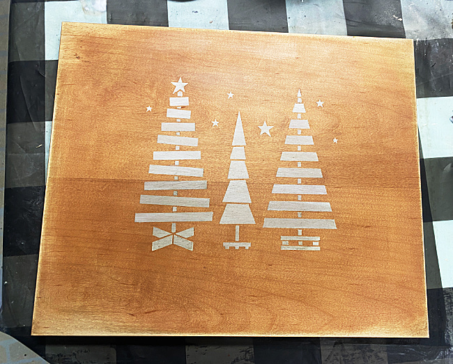 stained cutting board with tree stencil