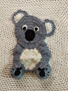 Koala in the centre of the blanket