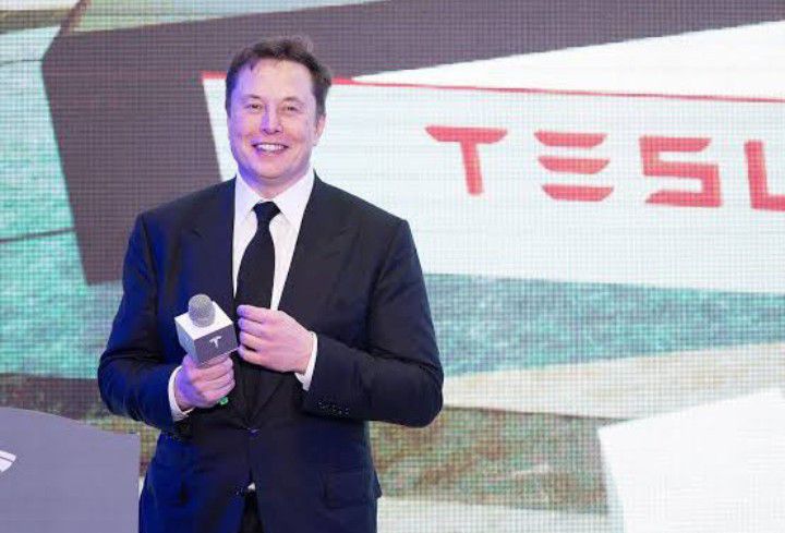 Tesla profit falls but company strikes new production level