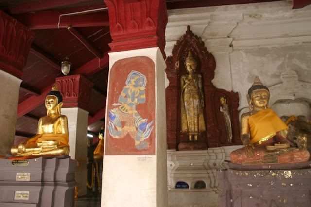 Notice there is a row and layers of statues. Each row is another era moving through to the current times. Inside Wat Phra Mahathat.