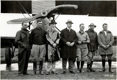 World Flight crewmembers are welcomed by the President upon their arrival in Washington, D.C. (left to right): Lt. Leslie Arnold; Lt. Lowell Smith; President Calvin Coolidge; Secretary of War John Wingate Weeks; Lt. John Harding; Lt. Odgen and Lt. Leigh Wade posed standing in front of the Douglas World Cruiser DWC-2 "Chicago" (s/n 23-1230) at Bolling Field, Washington, D.C., 9 September 1924.