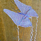 http://www.ravelry.com/patterns/library/3-d-crochet-butterfly-with-wire