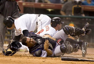 Ramon Castro gets plowed over by 2 runners at once