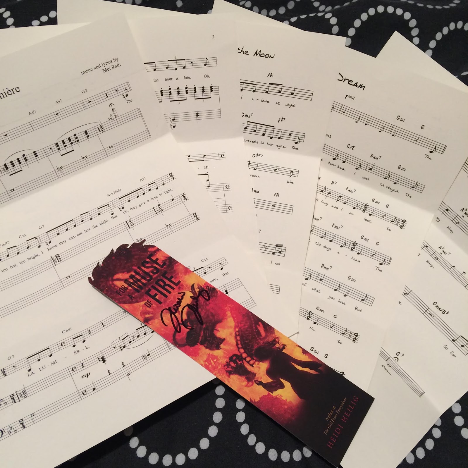 Sheet music for the songs featured in For a Muse of Fire, plus a bookmark