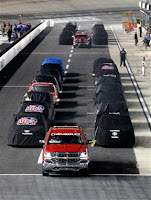 Trucks parked on pit road due to weather. #NASCAR