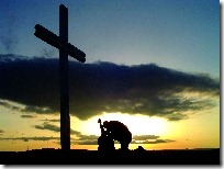 guy_kneeling_at_cross
