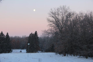 photo of moon setting in the West