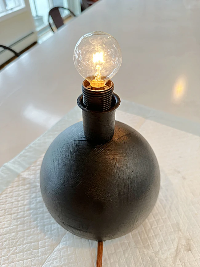 black round lamp with small bulb