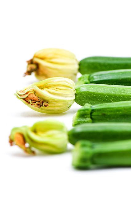 Young zucchini flower focus in the middle