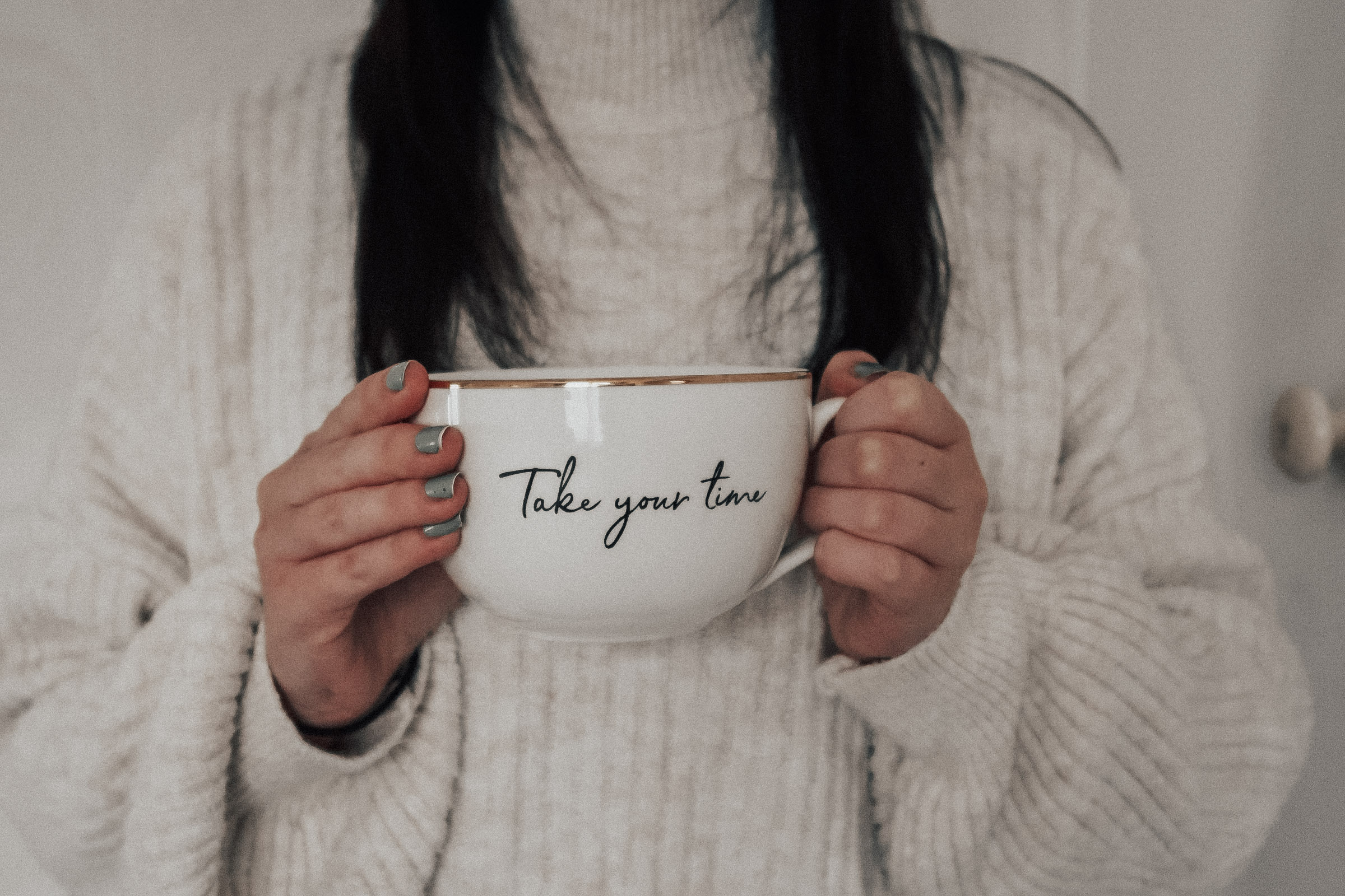 A woman holding a mug.