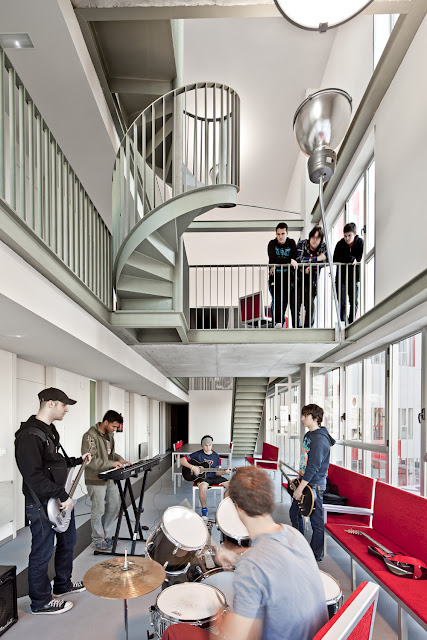 Photo of students playing with the instruments inside of the complex