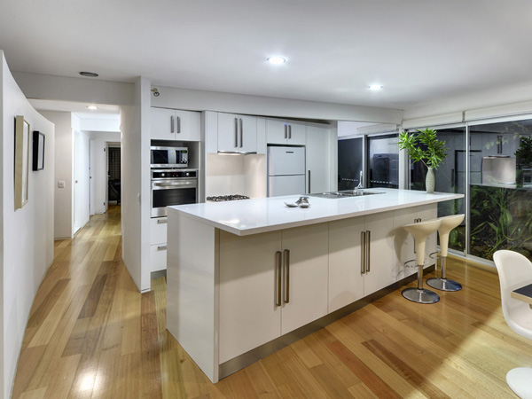 White Kitchen With Stainless Steel Appliances