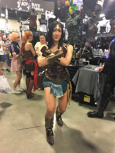 Wonder Woman in her defensive pose.