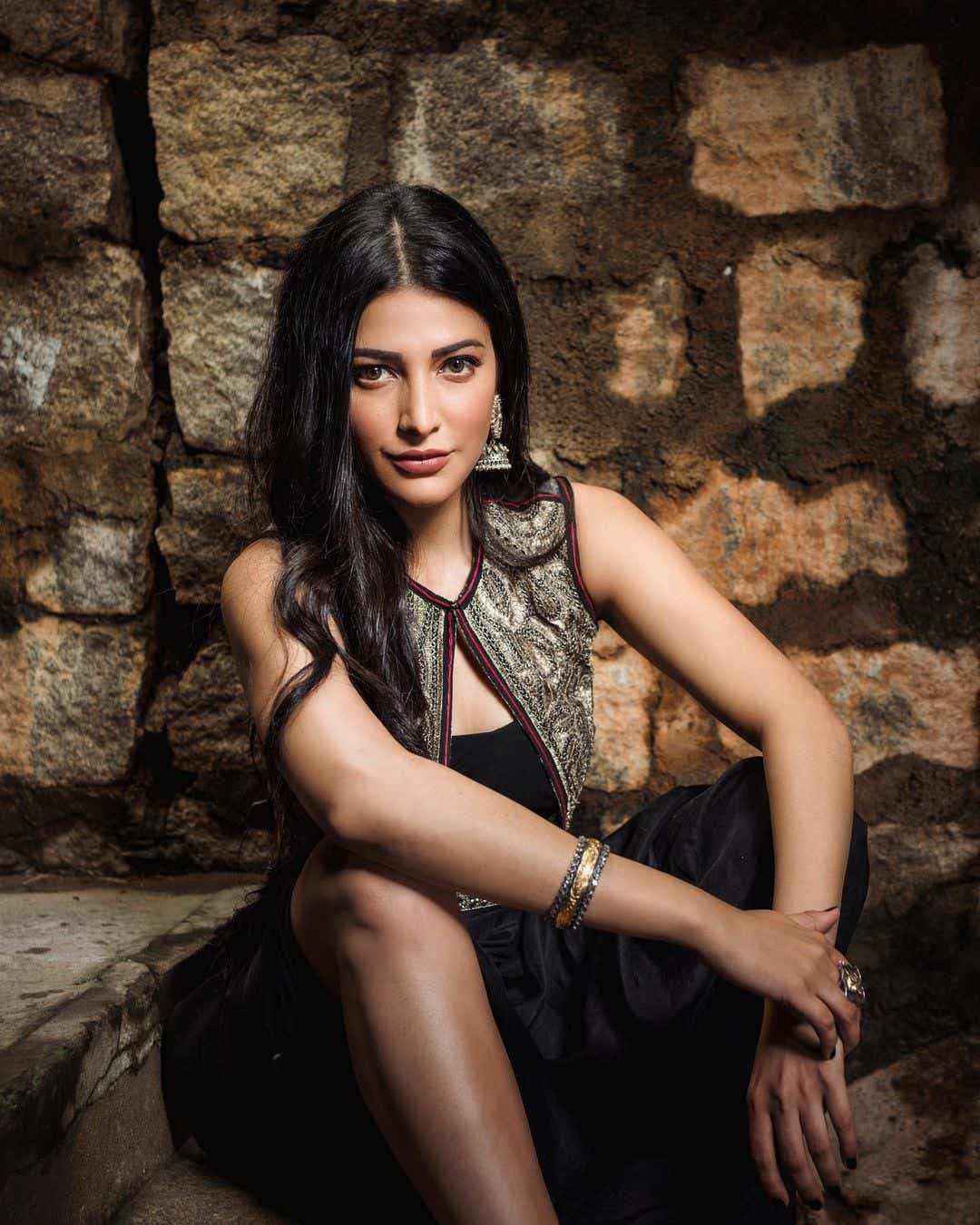 Actress Shruti Haasan looks captivating in a black dress photoshoot. Download high-resolution images for free.