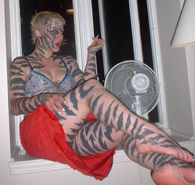 the heavily modified female performance artist and tattoo artist Katzen, 