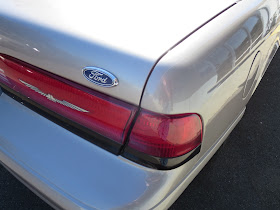 Dented quarter panel and misaligned trunk on Thunderbird after repairs at Almost Everything Auto Body