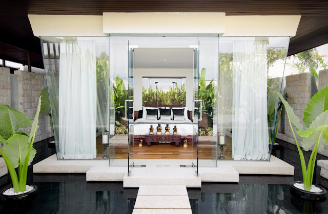 Picture of an amazing bedroom with glass walls floating on the water 