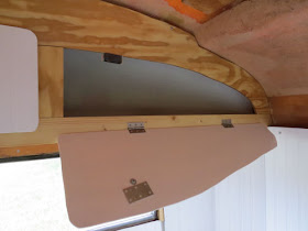 door for an upper storage bin in a fiberglass trailer