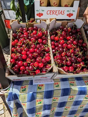 Boxes of cherries for sale at the cherry festival in Alcongosta Portugal