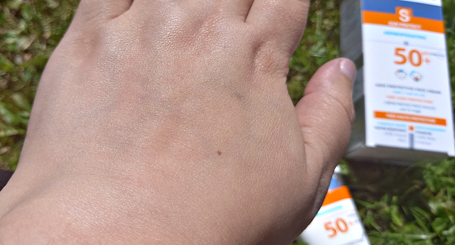 Sun cream on my hand