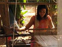 Thai weaver working at her floor loom