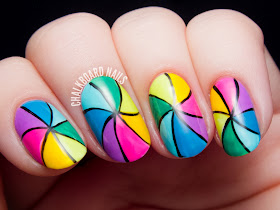 Rainbow pinwheel nail art by @chalkboardnails