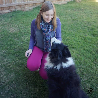 awayfromblue Instagram | pink and purple cardigan and skinny jeans outfit with grey tee and super cute fluffy dog