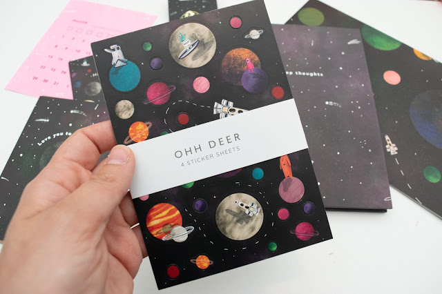 Space themed sticker sheets with planets, astronauts and aliens